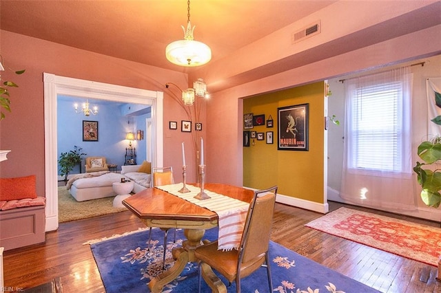 dining area featuring dark hardwood / wood-style floors