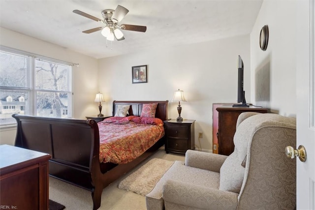 bedroom with light colored carpet and ceiling fan