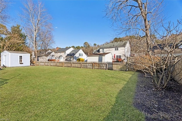 view of yard featuring a storage unit