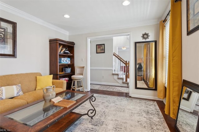 living room featuring ornamental molding and dark wood-type flooring