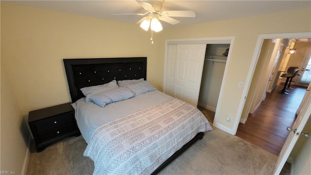 bedroom with ceiling fan and a closet