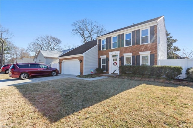 colonial inspired home with a garage and a front yard