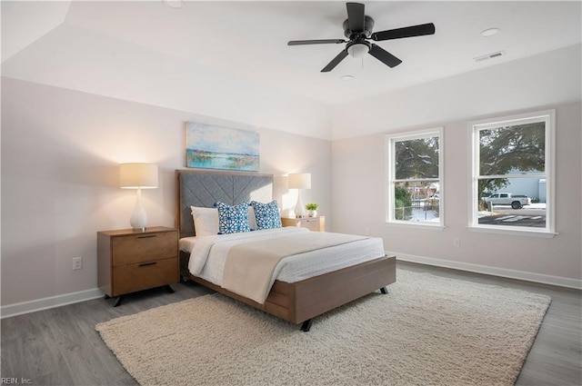 bedroom with wood-type flooring and ceiling fan