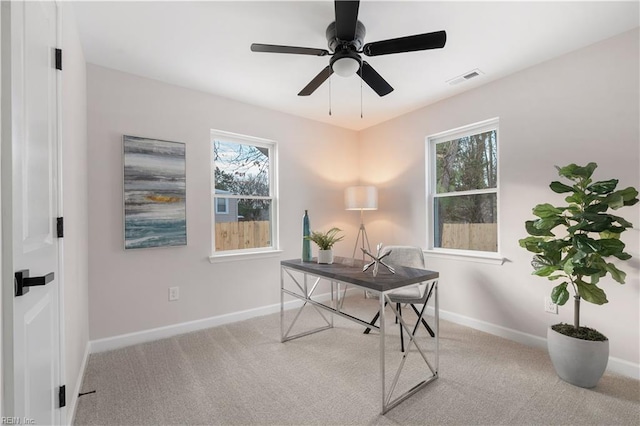 office area featuring light colored carpet and ceiling fan