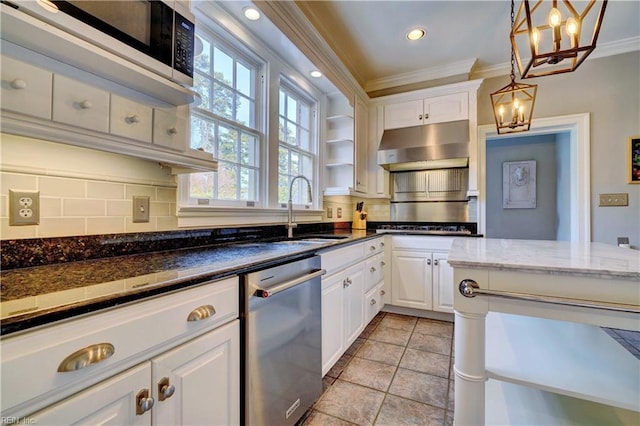 kitchen featuring sink, white cabinetry, tasteful backsplash, stainless steel dishwasher, and dark stone counters