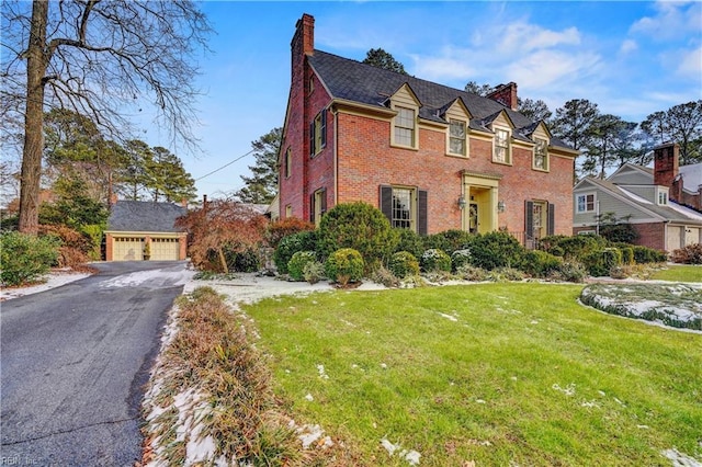 view of front of home with a garage and a front yard