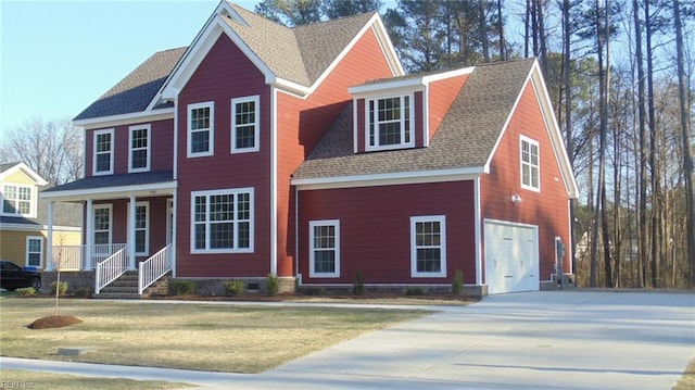 view of front facade with a garage, a porch, and a front lawn