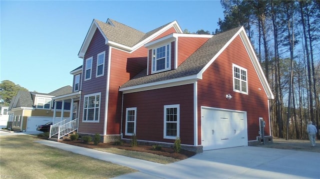 view of side of property with a garage