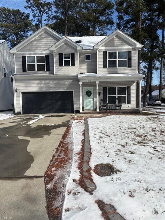 view of front facade with a garage and a porch