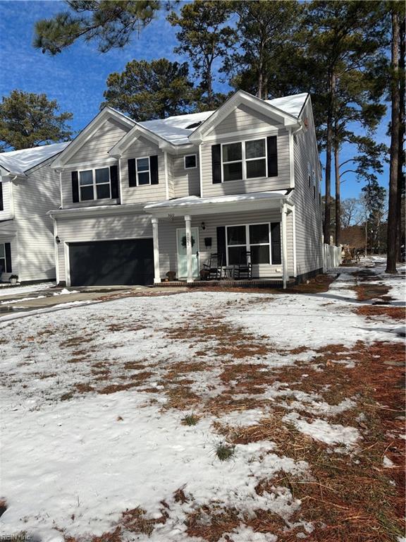 view of front of home featuring a garage and covered porch