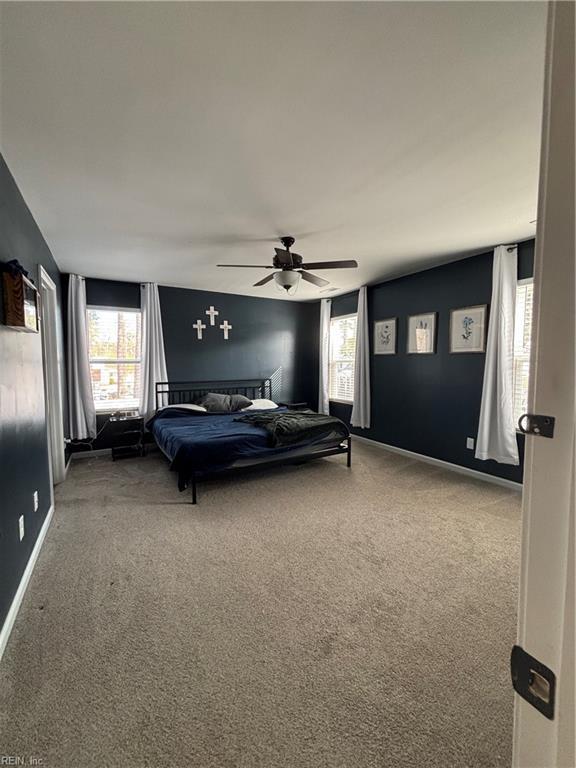 bedroom with ceiling fan and carpet