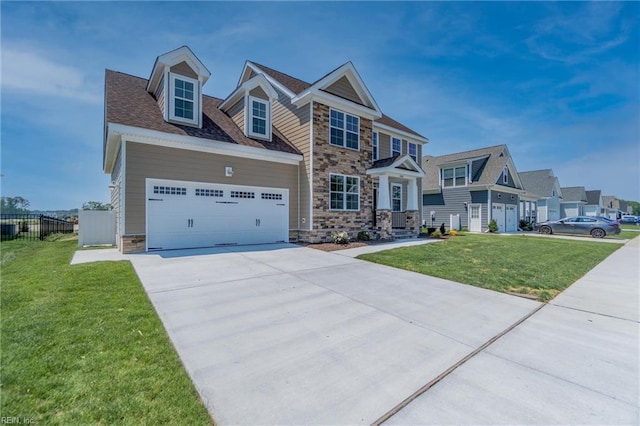 view of front of home with a garage and a front yard