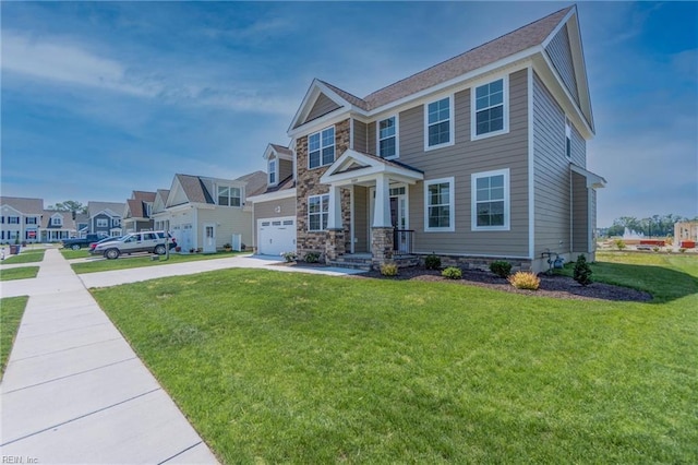 view of front of property with a garage and a front yard