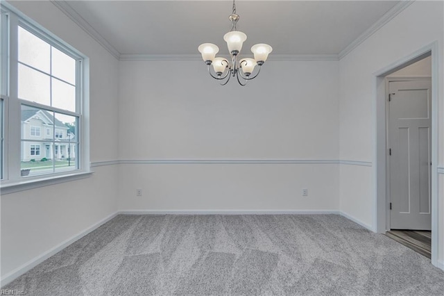 empty room featuring crown molding, light carpet, and a notable chandelier