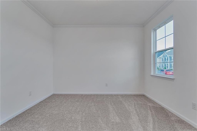 carpeted spare room with crown molding