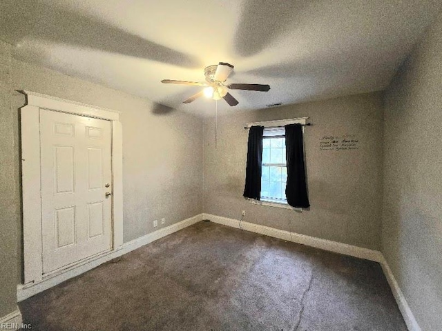 carpeted empty room with ceiling fan