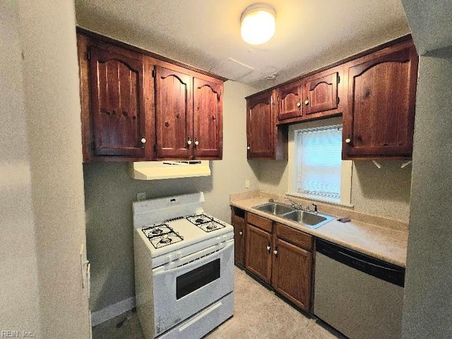 kitchen with white gas range, sink, and stainless steel dishwasher