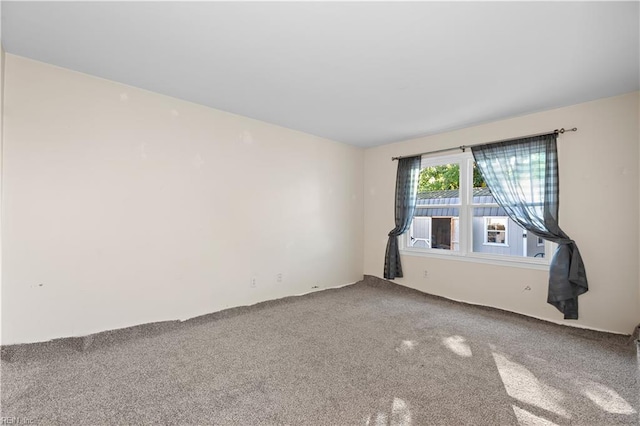 unfurnished room with carpet floors