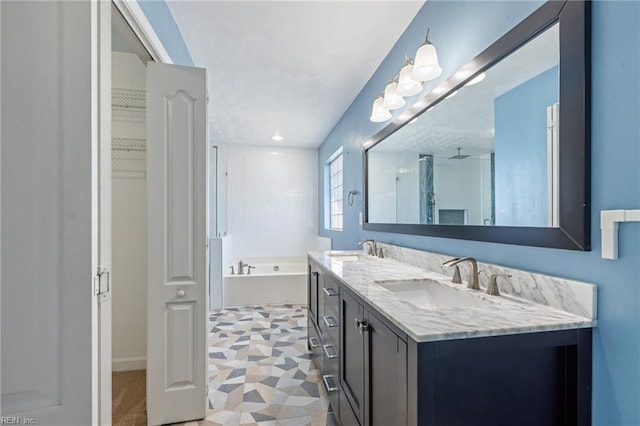 bathroom featuring plus walk in shower and vanity