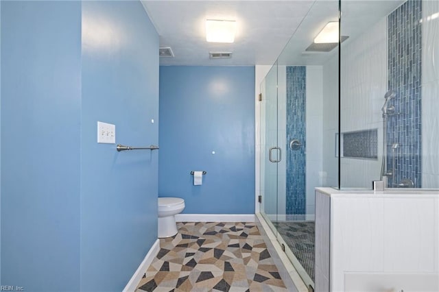 bathroom with toilet and walk in shower