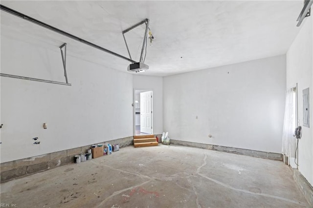 garage featuring a garage door opener and electric panel