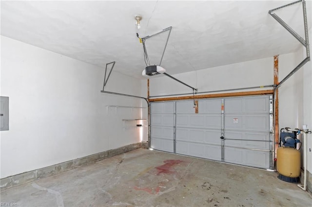 garage with a garage door opener and electric panel