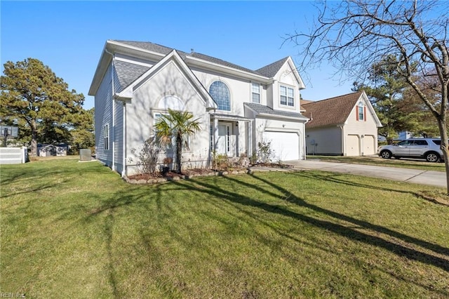 view of front of property featuring a garage and a front yard