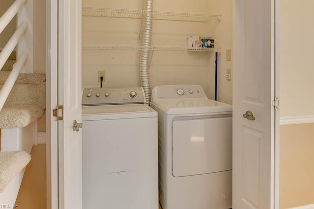 washroom with washer and dryer