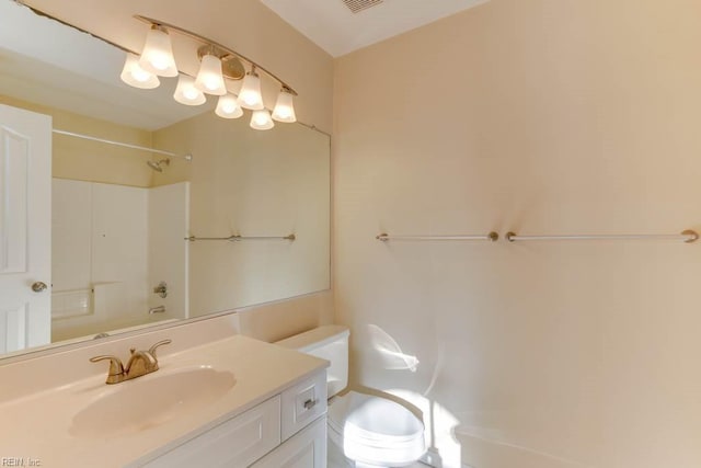 full bathroom with shower / tub combination, vanity, and toilet