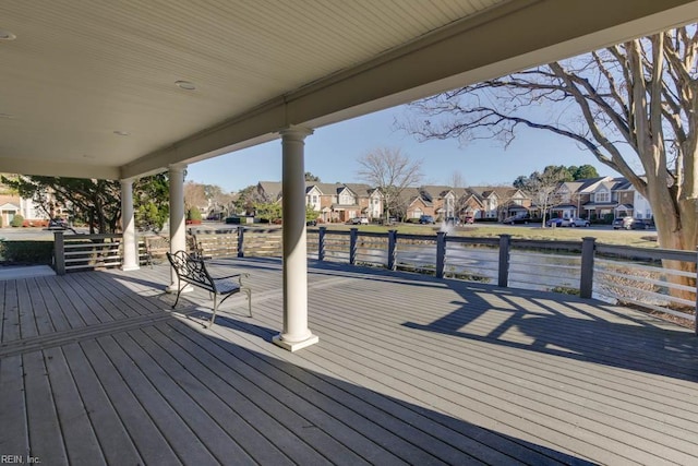 wooden terrace with a water view