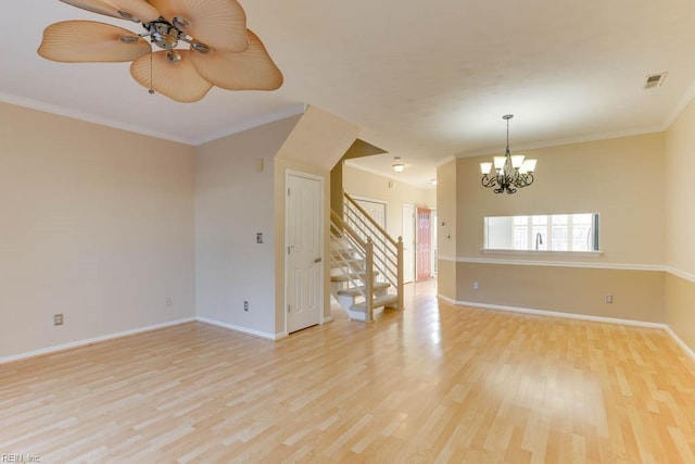 spare room with crown molding, ceiling fan with notable chandelier, and light hardwood / wood-style floors