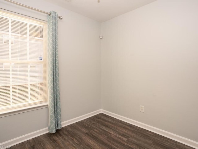 empty room featuring dark wood-type flooring