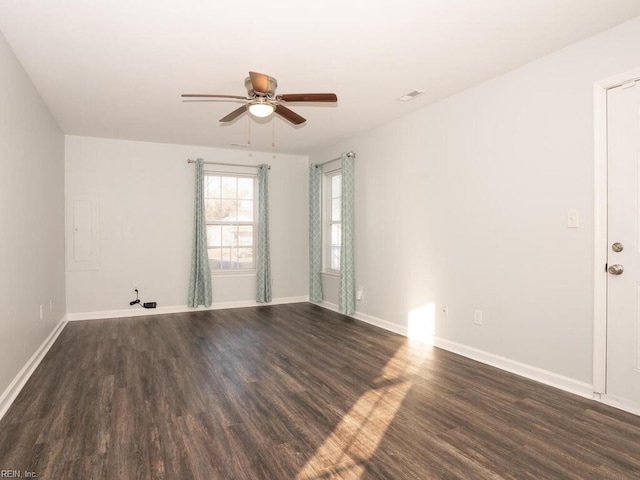 unfurnished room with dark hardwood / wood-style flooring and ceiling fan