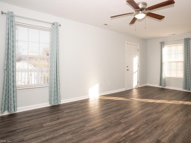 empty room featuring dark hardwood / wood-style floors and ceiling fan