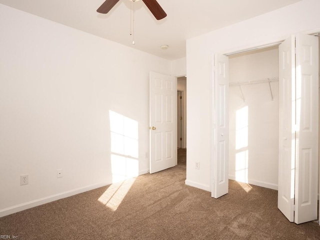 unfurnished bedroom with carpet floors, a closet, and ceiling fan