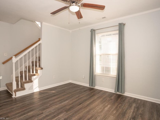 unfurnished room featuring dark wood-type flooring, ceiling fan, ornamental molding, and plenty of natural light