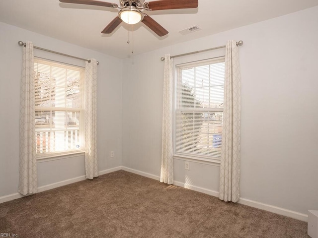 unfurnished room featuring carpet and ceiling fan