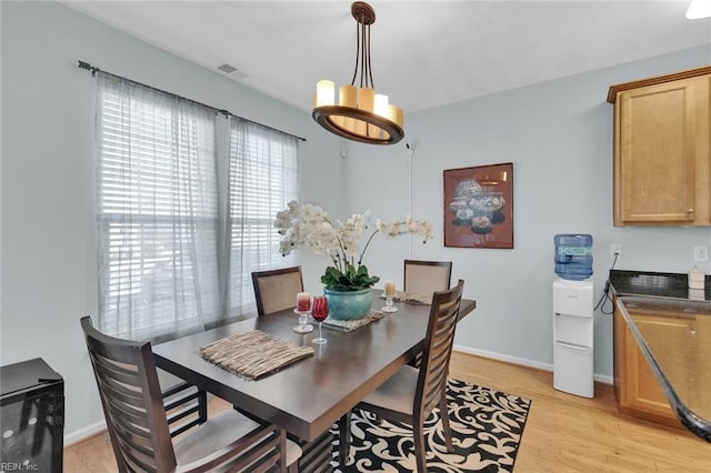 dining space featuring light hardwood / wood-style floors