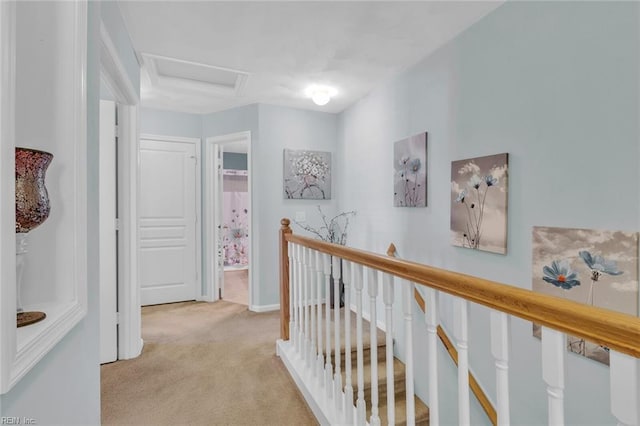 hallway featuring light colored carpet