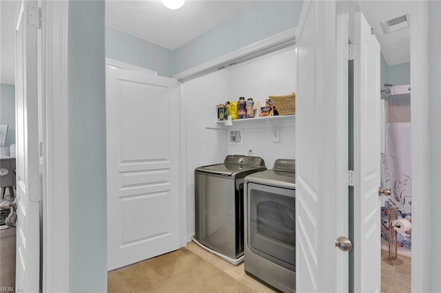 laundry area with independent washer and dryer