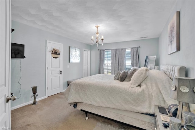 carpeted bedroom featuring a chandelier