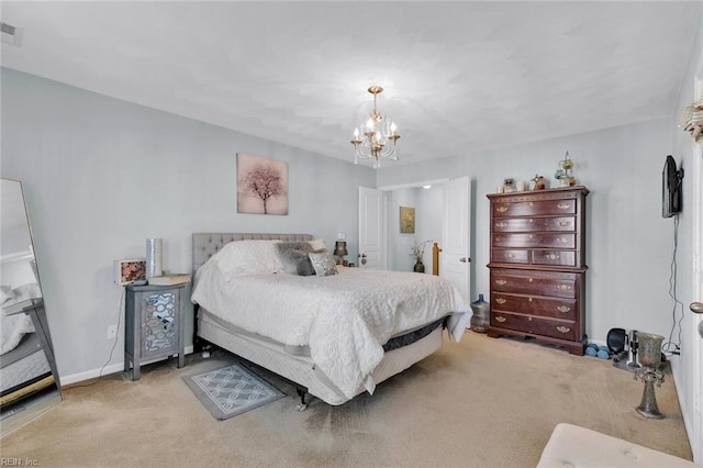 carpeted bedroom with a chandelier