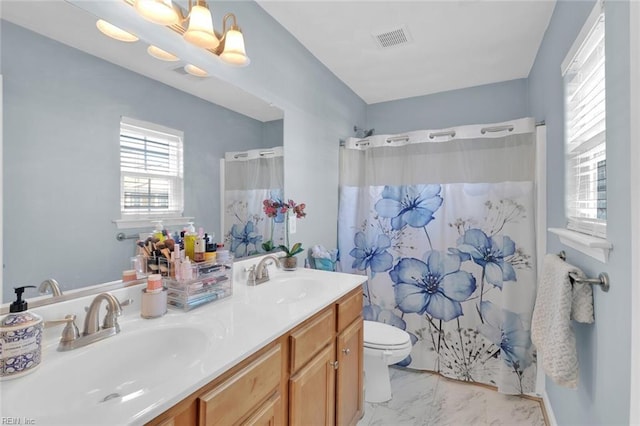 bathroom with vanity, toilet, and a shower with shower curtain