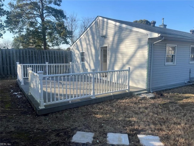 back of house featuring a deck