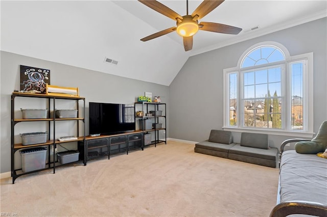 carpeted living room featuring lofted ceiling, crown molding, and ceiling fan