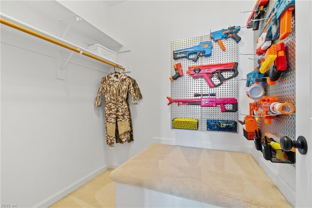 walk in closet with carpet floors