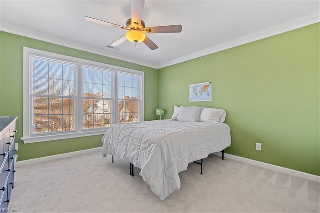 bedroom with light carpet, crown molding, and ceiling fan