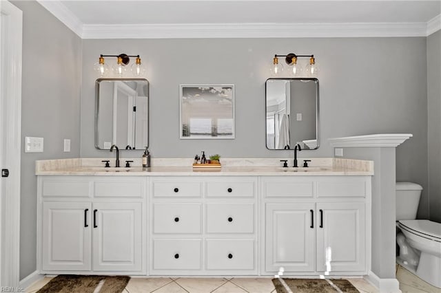 bathroom featuring vanity, tile patterned flooring, crown molding, and toilet