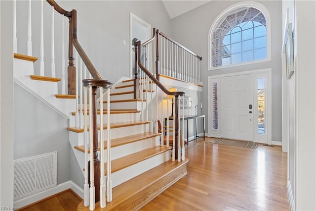 foyer featuring a high ceiling and light wood-type flooring