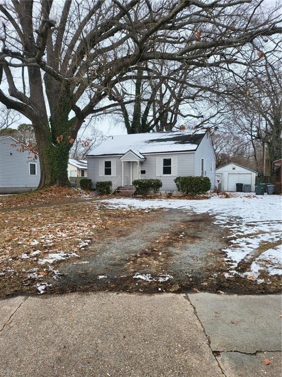 view of front of property featuring an outbuilding and a garage